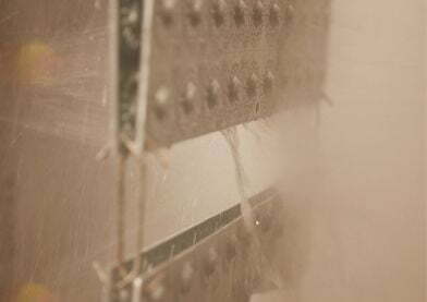 Metal components being sprayed and washed